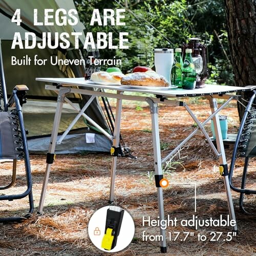 Adjustable camping table with chairs, drinks, and food, suitable for uneven terrain.