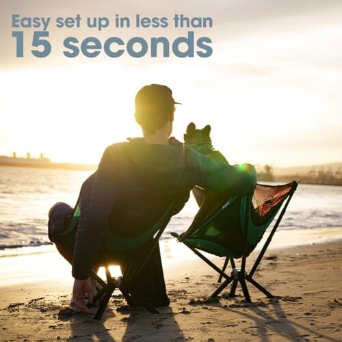 Person and dog sitting on portable chairs at beach during sunset.