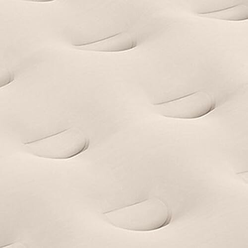 Close-up of quilted beige fabric texture