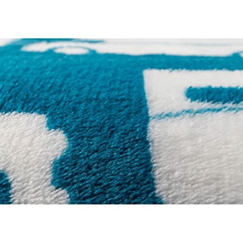 Close-up of blue and white fleece blanket texture