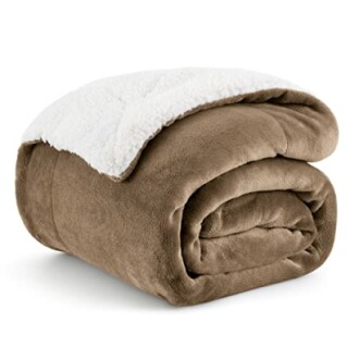 Folded brown fleece blanket with white lining