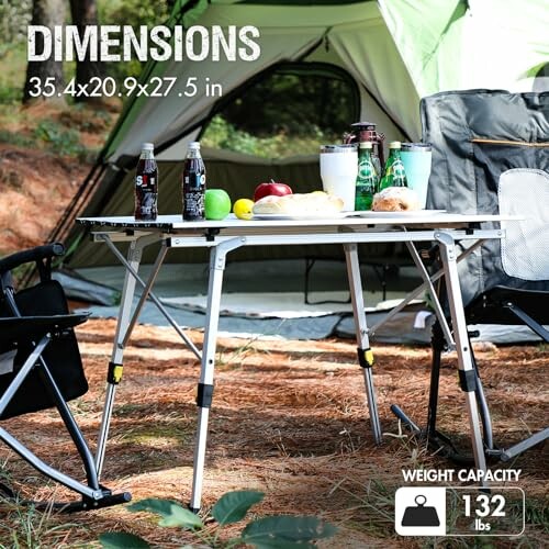 Camping table with drinks and food, tent in background.