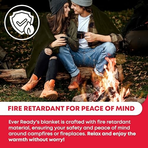 Couple by campfire with fire retardant blanket for safety.