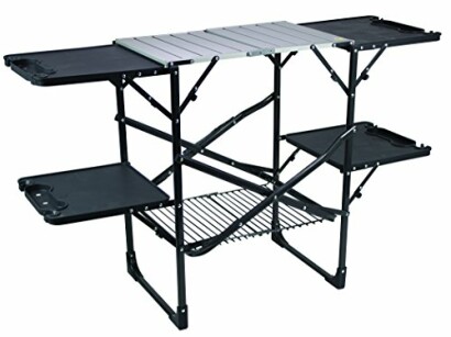 Foldable camping kitchen table with shelves and storage.