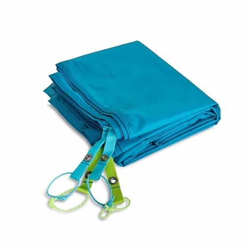 Folded blue tarp with attached straps.