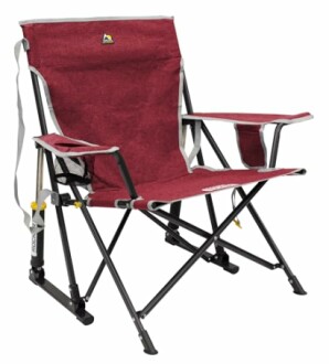 Red folding camping chair with armrests and cup holder