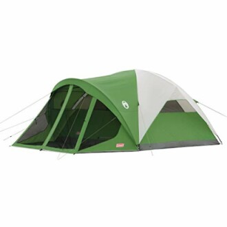 Green and white camping tent with multiple sections.