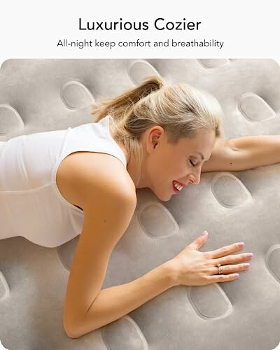 Woman lying comfortably on a luxurious mattress.