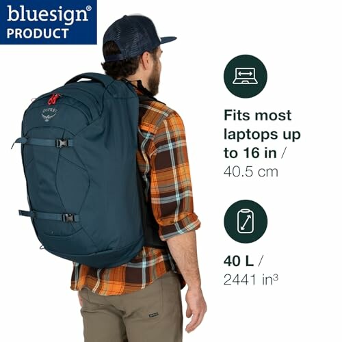 Man wearing blue Osprey backpack, fits laptops up to 16 inches, 40L capacity.