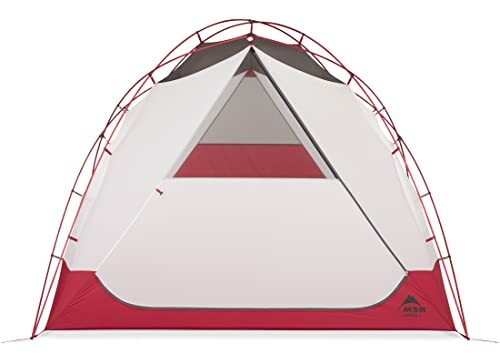 Red and white camping tent with geometric design.