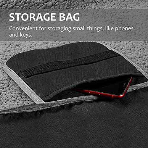 Storage bag with pocket holding a phone