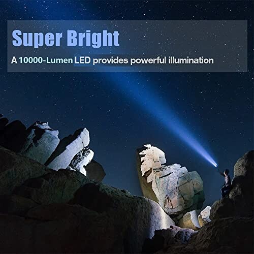 Person using a 10000-lumen LED flashlight to illuminate rocks at night.